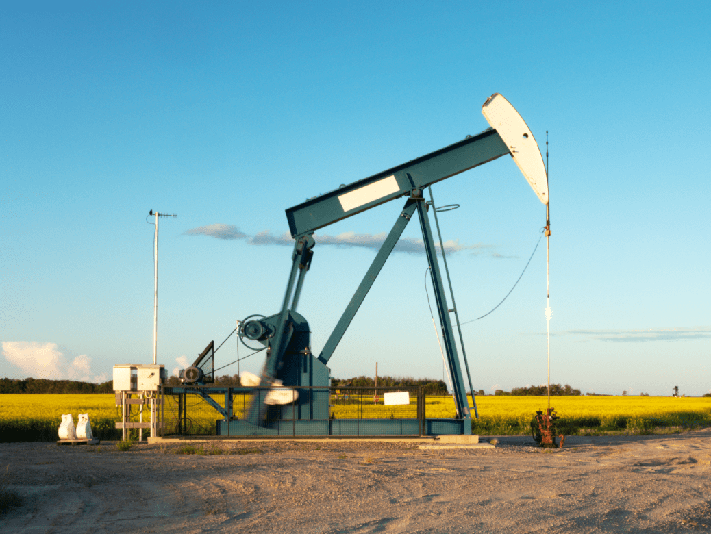 Oil pumpjack in a sunny field