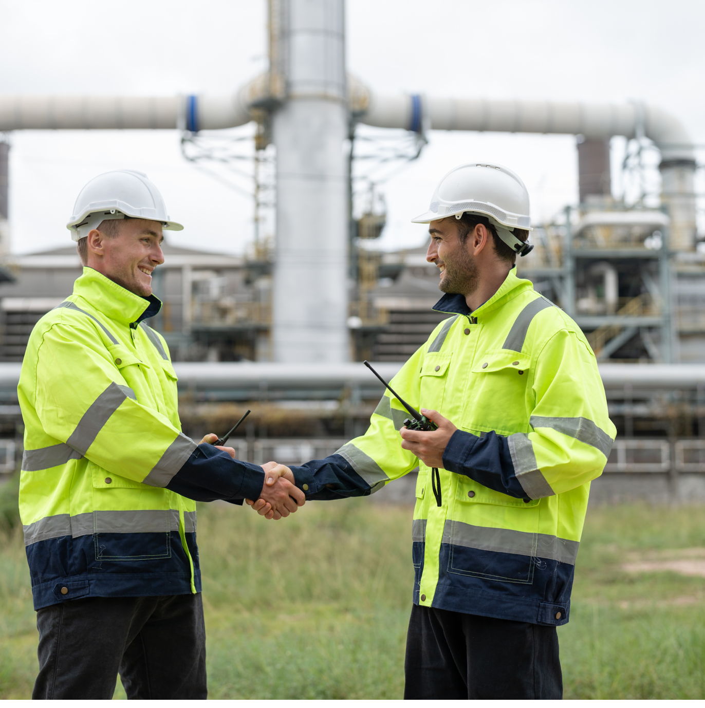 Workers in safety gear at factory